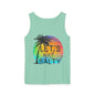 A mint green tank top with a graphic design featuring a palm tree and a colorful sunset.