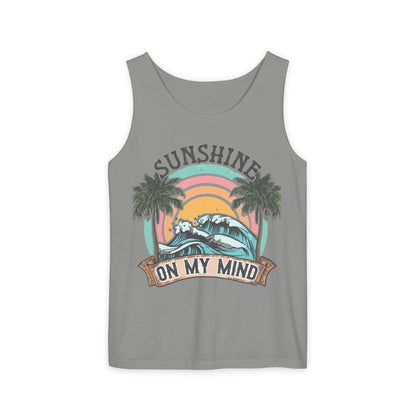 A gray tank top with a graphic design featuring a sunset, palm trees, and the text "SUNSHINE ON MY MIND".
