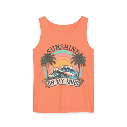 The image is a bright orange tank top with a graphic design featuring a sunset, palm trees, and the text "SUNSHINE ON MY MIND".