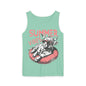 A green tank top with a graphic design of a cow wearing sunglasses and resting on a red inner tube, with the text "SUMMER VIBES" written above the image.