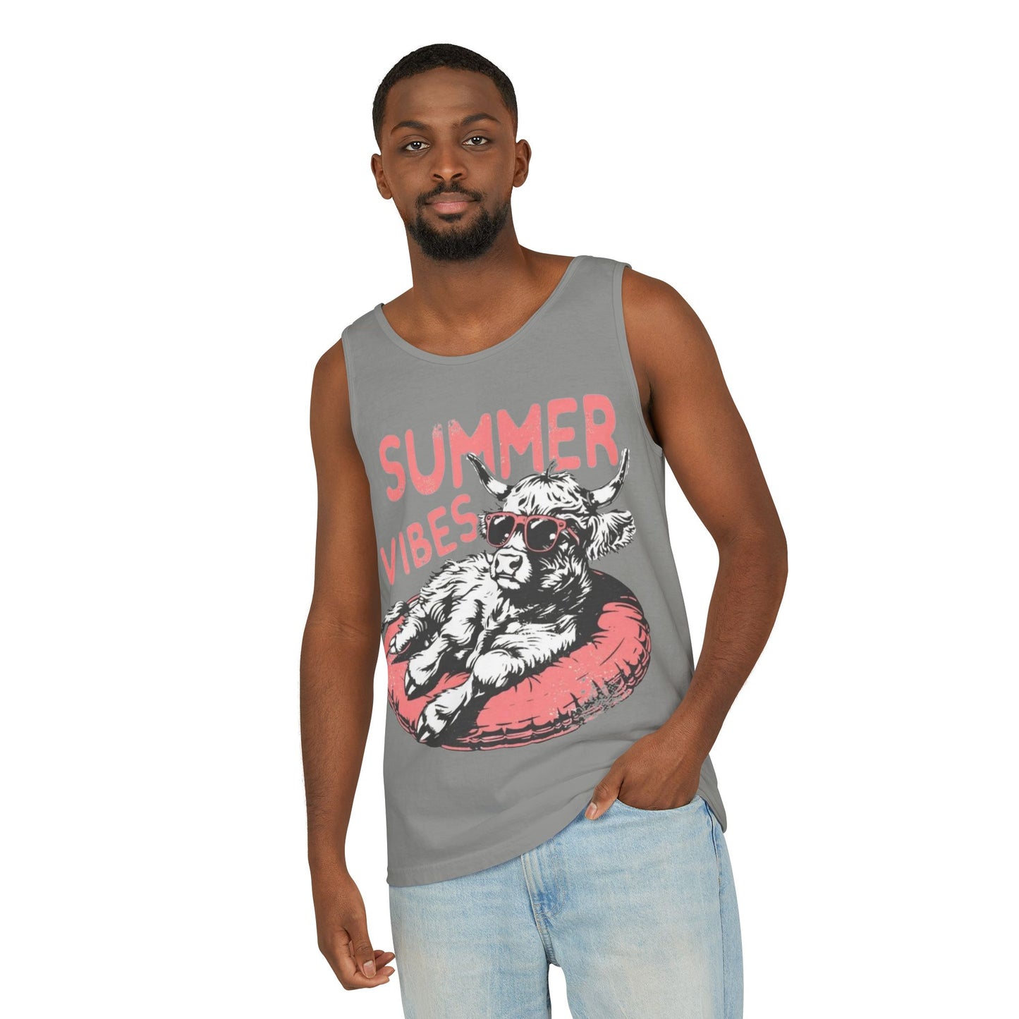 A man wearing a gray tank top with a graphic of a cow and the text "SUMMER VIBES" printed on it.