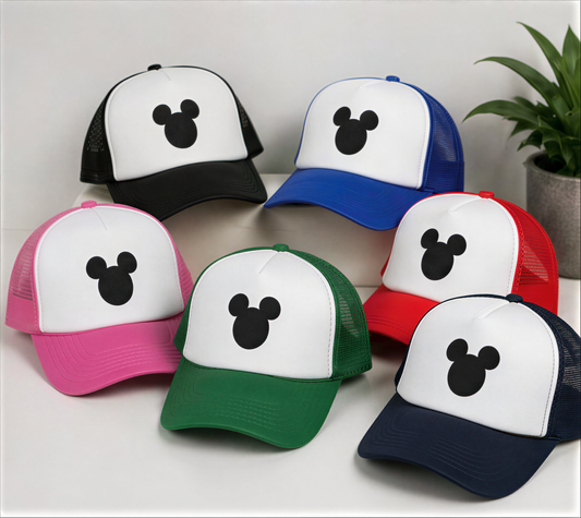 A collection of seven colorful baseball caps with Mickey Mouse designs, arranged in a row on a white surface.