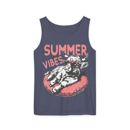 A graphic t-shirt design featuring a cow wearing sunglasses and lying on a red inner tube, with the text "SUMMER VIBES" above the image.