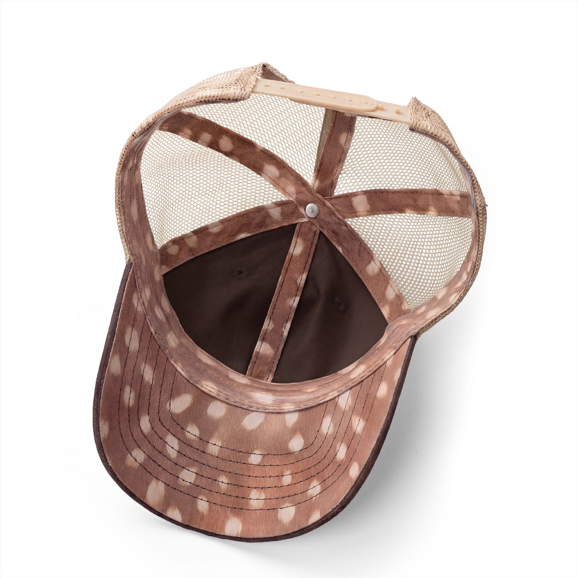 the inside of a brown and white spotted baseball cap with a mesh back.