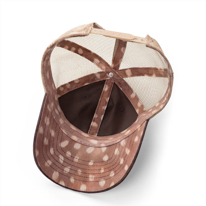 the inside of a brown and white spotted baseball cap with a mesh back.