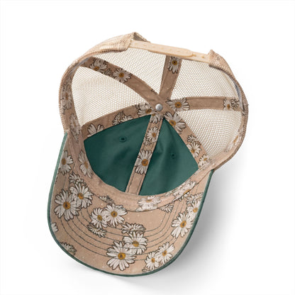 the inside of a baseball cap with a floral pattern on the brim and a green interior.