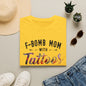a yellow t-shirt with the text "F-BOMB MOM WITH Tattoos" printed on it, along with a pair of jeans, sunglasses, and a straw hat.