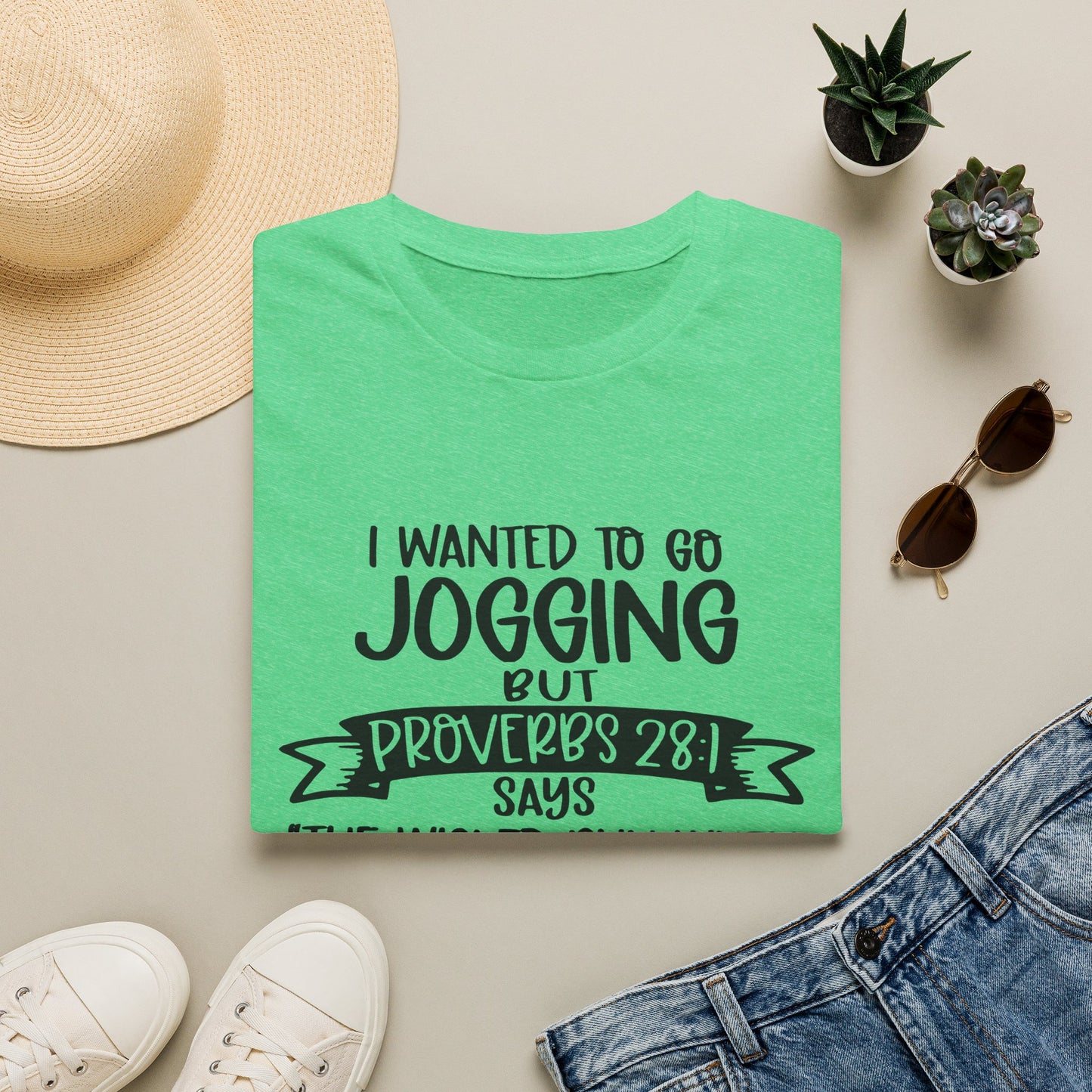 a green t-shirt with a humorous text, a pair of sunglasses, a hat, a pair of sneakers, and some potted plants.