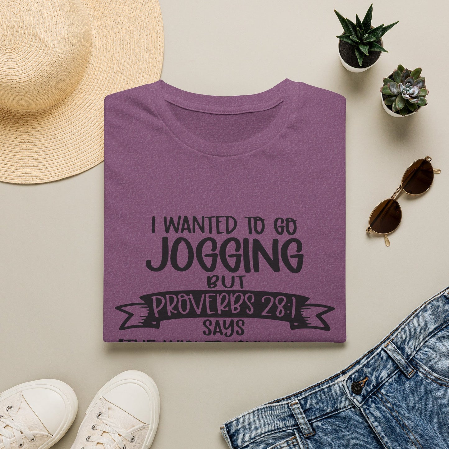 a purple t-shirt with a humorous text, a pair of jeans, sunglasses, a hat, and some potted plants arranged on a flat surface.