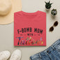a red t-shirt with the text "F-BOMB MOM WITH Tattoo" printed on it, along with a pair of jeans, sunglasses, and a straw hat.
