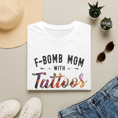 a white t-shirt with the text "F-BOMB MOM WITH TATToos" printed on it, along with a pair of jeans and sunglasses.