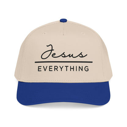 A beige baseball cap with a blue brim, featuring the text "Jesus Everything" printed on it.
