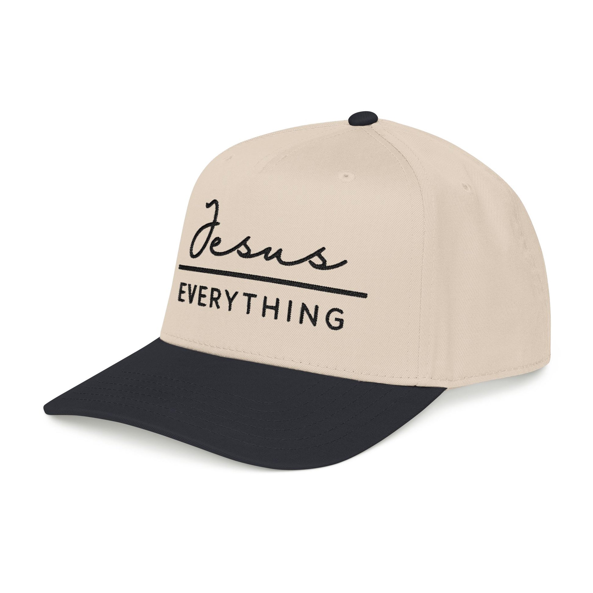 A beige baseball cap with the text "Jesus Everything" printed on it in black.