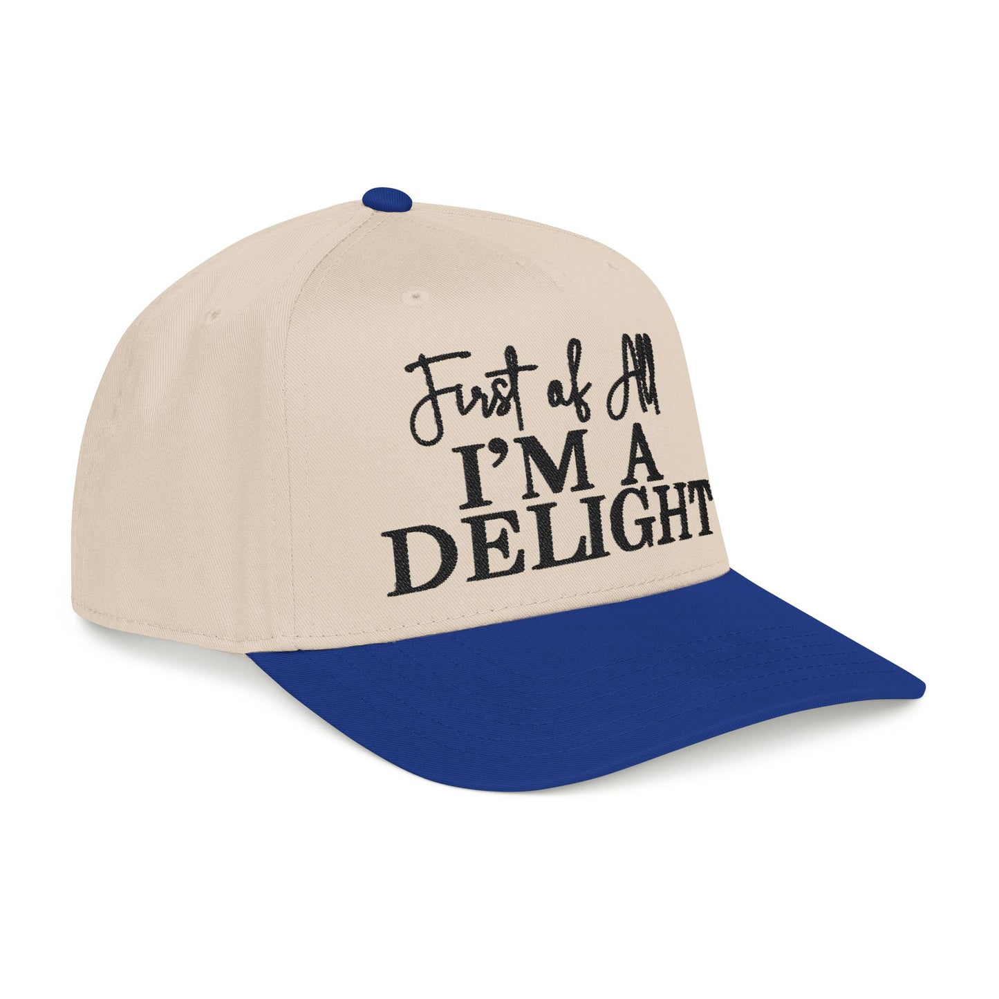 A beige baseball cap with a blue brim, featuring the text "Just of all I'm a DELIGHT" printed on it.